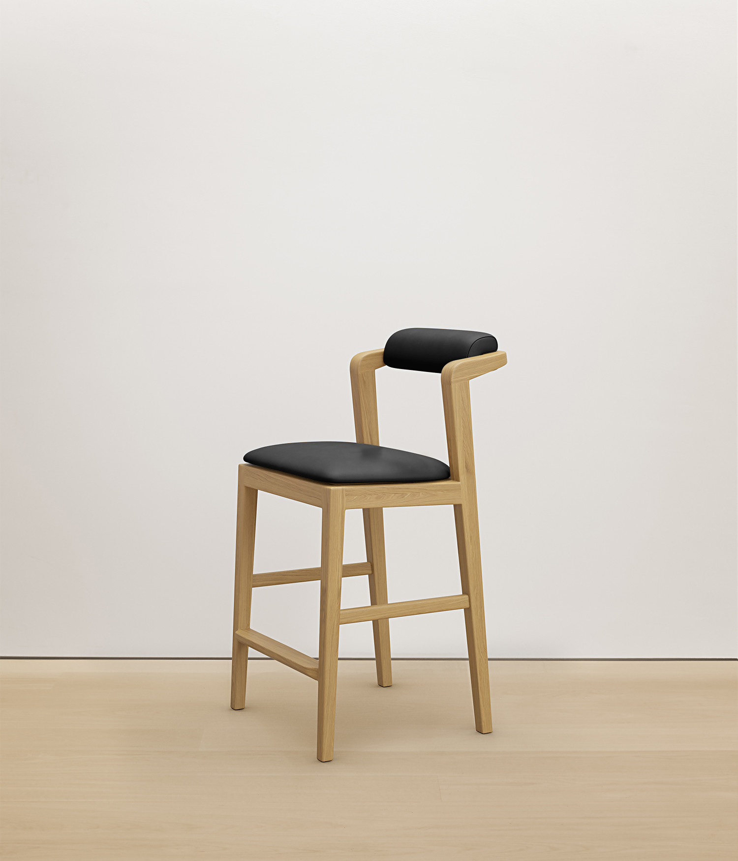  white-oak stool with black color upholstered seat