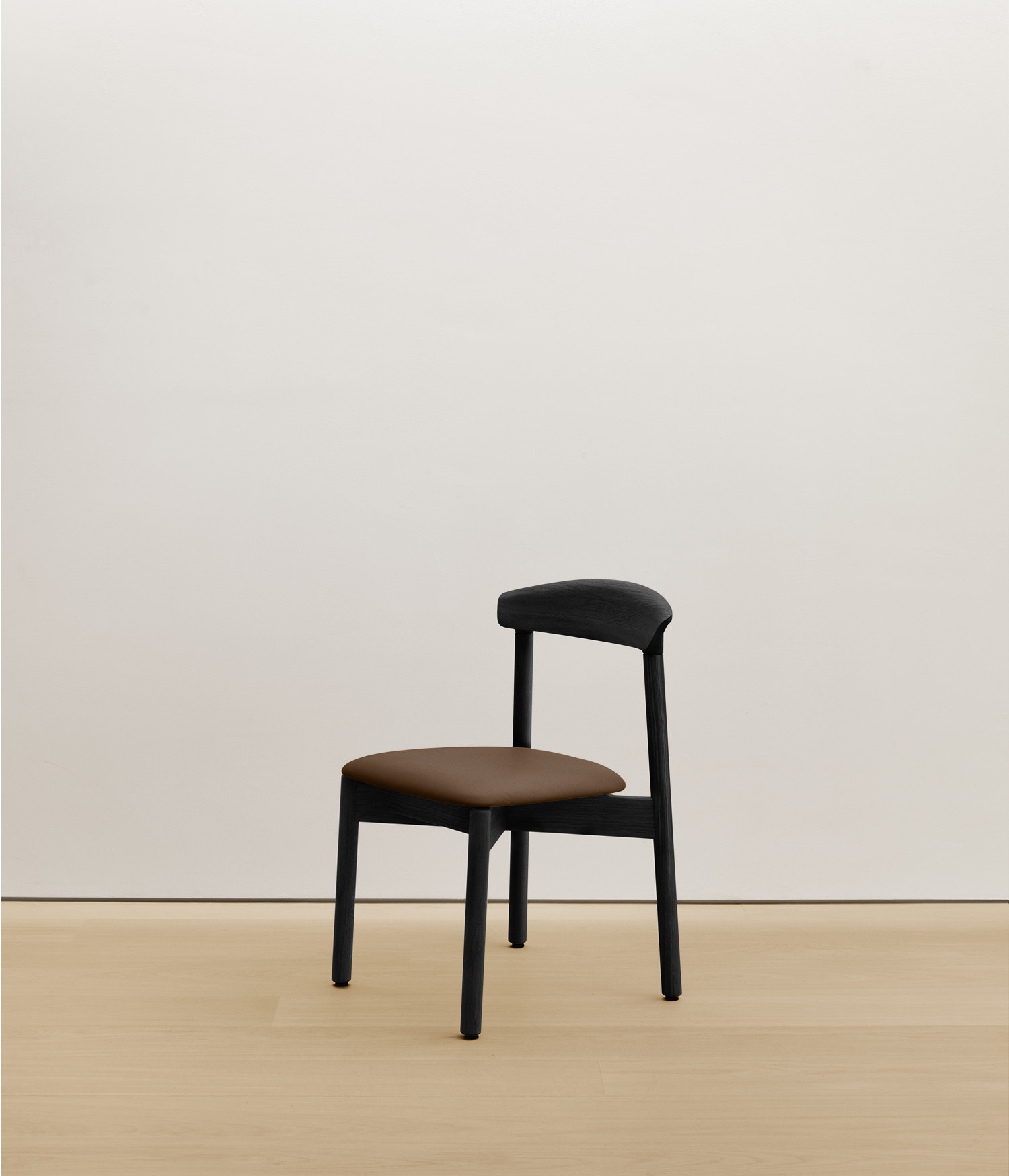 black-stained-oak chair with umber color upholstered seat
